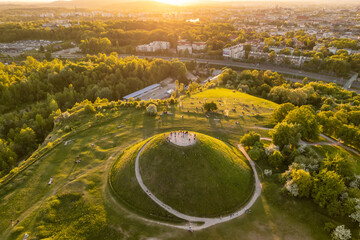 Aerial view of the Krakus Mound with sunset view of the historical part of Krakow old town, Poland.