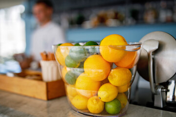 Fresh lemons and limes for preparing cocktail in a summer cafe or bar.