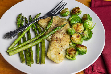 tilapia  with roasted  brussel sproutsand asparagus