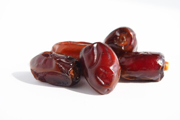 Ripe delicious fruit dates on a white background. dried date fruit