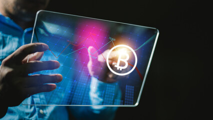 Businessman using tablet to connected on global network and gold bitcoin coin in fire and growth of business graph, Financial, Stock market, Cryptocurrency and investment.