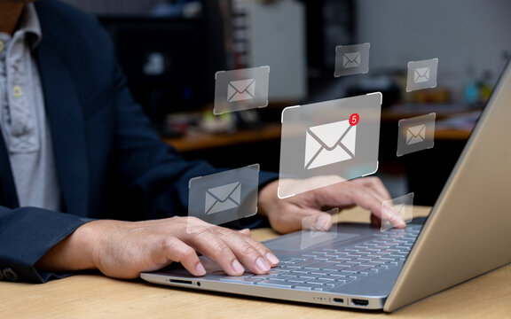 Businessman using laptop with email notification on virtual screen online communication concept