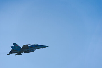 Fototapeta na wymiar Boeing FA-18 Hornet register J-5238 taking off from Emmen airbase, Canton Luzern, with blu cloudy sky in the background on a sunny spring day. Photo taken March 22nd, 2023, Emmen, Switzerland.