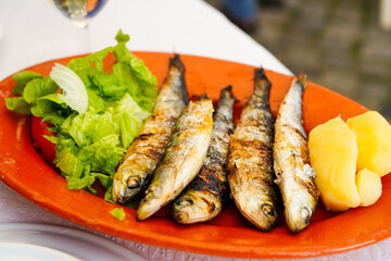 Grilled Portuguese sardines, Traditional Portuguese dishe served on the terrace of a Lisbon restaurant