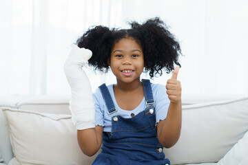 African - American black little girl have an accident at her right arm and see the doctor in...