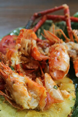 Shrimp shell and head waste after eating full on banana leaf on ceramic plate