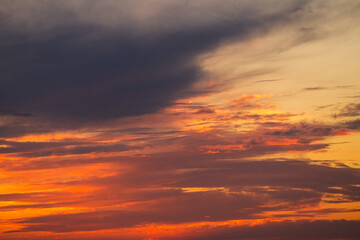 Orange sunrise sky landscape. Beautiful wallpaper photo with vivid color clouds on sky.