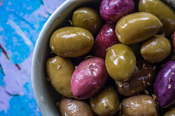 Mixed Greek olives in a bowl. Macro shot.