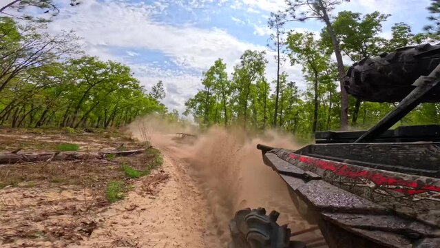 Rear view kicking up sand 4x4 side by side sxs ohv trails