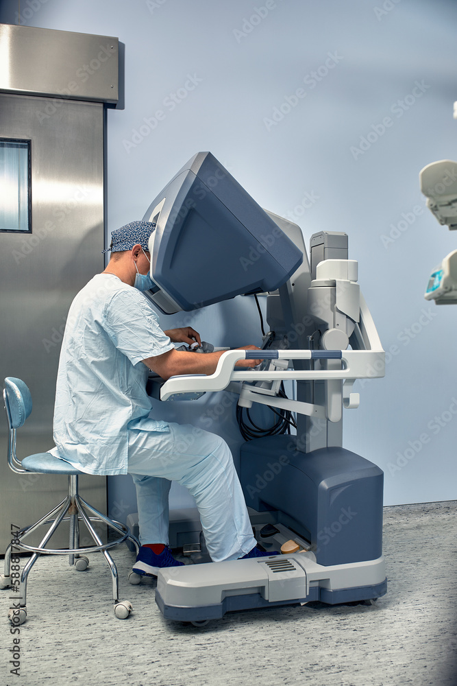 Aufkleber hands of a surgeon at a computer robot. medical robot. robotic surgery.