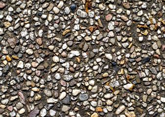 Texture of small colored pebbles of different sizes