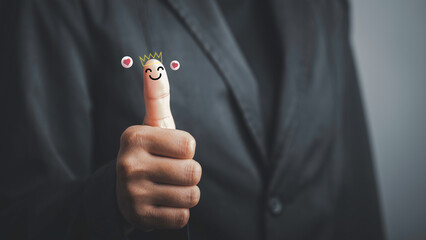 Businessman and show happy smiley face on thumb up with red heart emotion and crown, Good satisfaction feedback rating to service experience. Positive Review.Client Satisfaction Surveys,review.