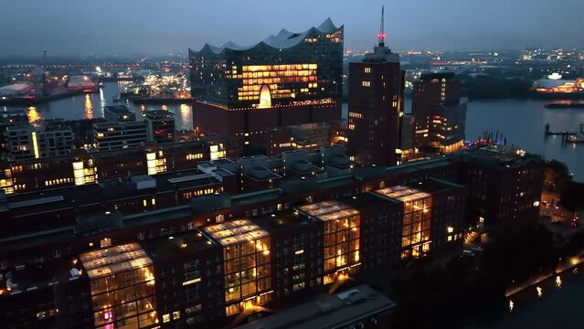 Establishing Aerial View Shot of Hamburg De, Mecklenburg-Western Pomerania, Germany, at night evening, rathaus, city falling asleep