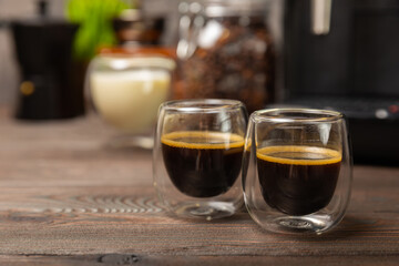 Black espresso coffee on a black table in a cafe.Strong hot fragrant coffee.Good morning concept. Barista. Coffee house concept. Place for text.