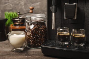 Coffee machine in modern kitchen interior. Fresh black aromatic coffee made in a home coffee-maker. morning coffee. Home Coffee machine in the kitchen. Place for text. copy space.