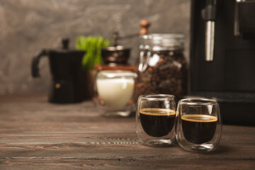 Black espresso coffee on a black table in a cafe.Strong hot fragrant coffee.Good morning concept. Barista. Coffee house concept. Place for text.