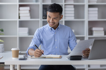 Obraz premium Portrait of Asian business man holding coffee cup with work in workplace office Business documents money financial planning concept