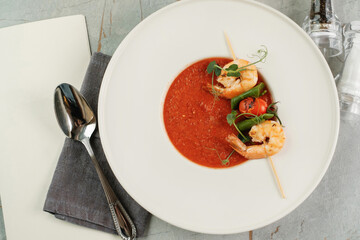 Gazpacho with shrimps. Serving food in a restaurant