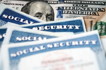 Social Security Cards with US One Hundred Dollar Bill $100