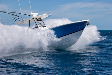 Close-up of a fast center console boat making spray.