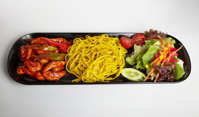 Grilled Chicken Linguine Pasta with Hot Sauce and Green Salad White Background