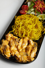 Grilled Chicken With Cheddar Sauce and Linguine Pasta with Green Salad White Background