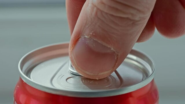 close up details man opens can of drink slow motion Refreshing Soda