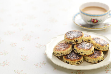 homemade Welsh cakes ( bakestones ) with a cup of milk tea