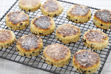 homemade Welsh cakes ( bakestones ) on a cooling rack