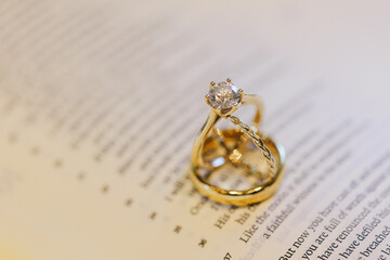 wedding rings on a book