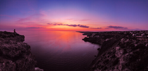 Beautiful colorful sunset at the montains at the sea