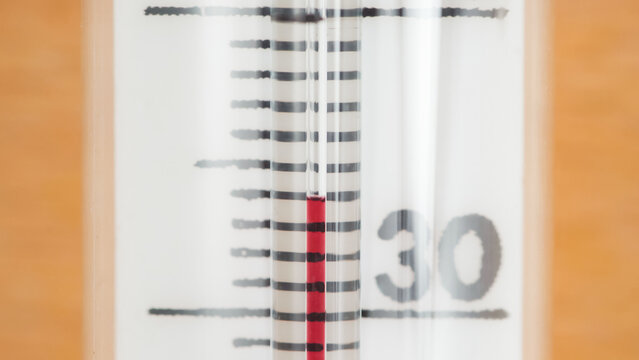 Glass thermometer on 34 degrees close up