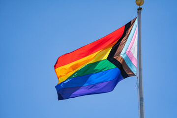 Close-up of Rainbow flag (LGBT movement) waving in the wind. 