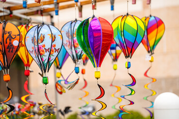 Rainbow Hot Air Balloons are sold at the fair. Garden decoration.
