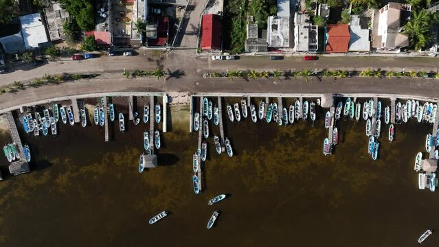 Aerial view of boats docked at the pier along the coast in Rio Lagartos, Yucatan, Mexico.