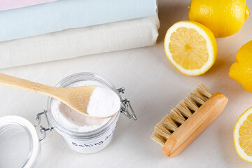 Eco friendly natural cleaner baking soda on a white table. isolated. top view. The concept of cleaning clothes stains