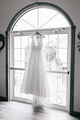 Fototapeta na wymiar wedding dress on the window