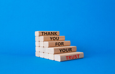 Thank you for your trust symbol. Wooden blocks with words Thank you for your trust. Beautiful blue background. Business and Thank you for your trust concept. Copy space