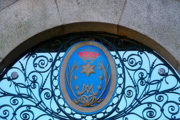 A metal symbol in cemetery gate in Church of Lapa, Oporto, Portugal