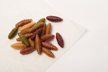 Pattern pastila fruit leather rolls up with fruits on white background.Horizontally.