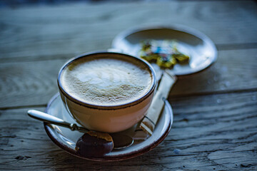 cup of coffee on wooden table