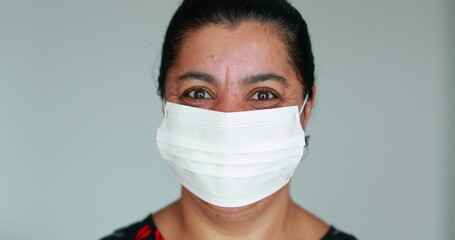 African black woman removing face mask against virus