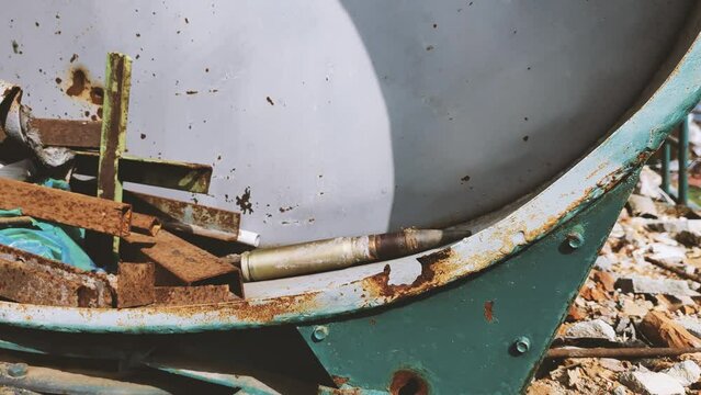 explosive objects - shells, rockets, mines, cartridges, bullets are lying in the fields of Ukraine and are waiting for sappers to clear them. An explosive object in a field in the Kherson region after