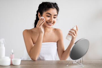 Beautiful Smiling Woman Cleansing Skin With Makeup Remover Lotion And Cotton Pad