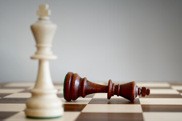 White king wins at chess closeup focus on black king