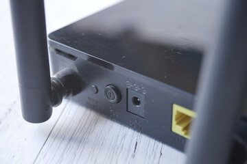Wi-Fi router with cables on table 