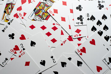 Scattered Playing Cards on a White Background