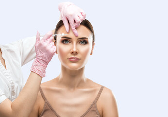 Cosmetologist does injections for lips augmentation and anti wrinkle injections of a beautiful...