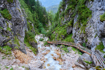 Silberkar gorge (Silberkarklamm), a whitewater gorge in the heart of the Dachstein massif, Alps, Austria. Wooden stairs, activity, hiking, Summer.