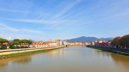 Cityscape of the city of Pisa with the river Arno. Panorama.